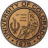 The image displays a round seal or emblem with the text UNIVERSITY OF COLORADO prominently at the top, followed by the year 1876 and the word DENVER beneath it. Below this text is an illustrated depiction of a torch flanked by two branches, one on each side. The seal has a circular border with a central design that includes a torch, two branches, and the words Let your light shine. Around the outer edge of the seal, there is a ring with a smaller inscription that reads COLORADO at the top and 1876 at the bottom. The background of the image is white, which contrasts with the golden color of the emblem.